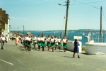 Marching up the harbour road, in the sunshine, Cobh.