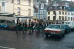 Marching through the town centre, in the rain, Cobh.